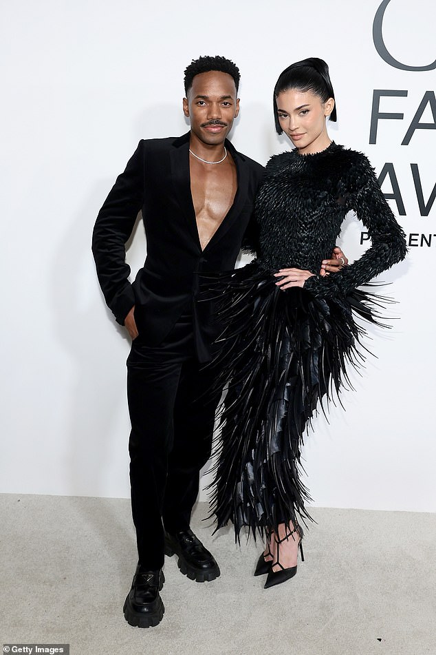 At the event, she posed with boyfriend Carter Gregory, who went shirtless under a black velvet suit