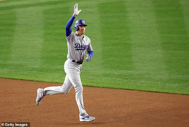 Freeman waves to the Bronx as he rounds the bases in the top of the first inning on Monday