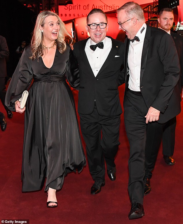 Ministerial ethics standards dictate that a minister must not 'seek or encourage any form of gift in his personal capacity' (photo Anthony Albanese, right, Alan Joyce centre, with the Prime Minister's fiancée Jodie Haydon)