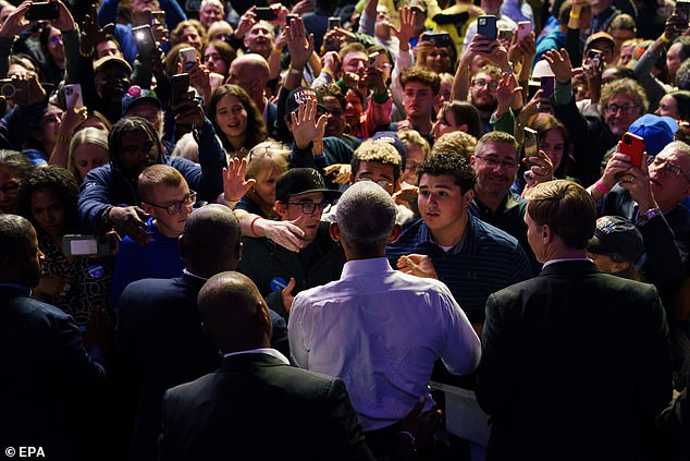 Former President Barack Obama, pictured in the middle of a crowd, also appeared at a rally for Harris in Philadelphia on Monday. There, he blasted Trump for holding a “racist, sexist, bigoted” event at Madison Square Garden the night before