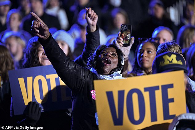 Supporters cheer for Harris and hold up 