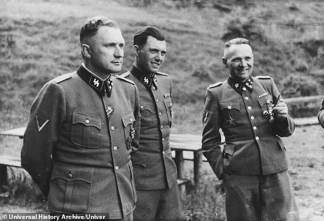 Mengele (center) seen with Auschwitz commander Richard Baer (left) and former commander Rudolf Hoess on the grounds of the SS retreat outside Auschwitz, 1944