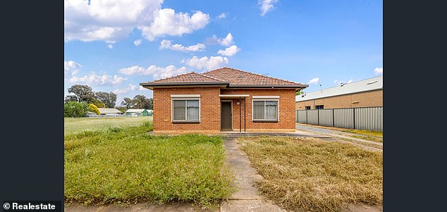 The only buildings on the property are a small barn and this three-bedroom house built in 1955