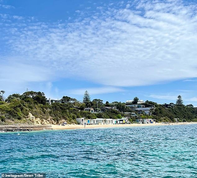 Tribe shared a photo of the waterfront at Portsea's Fishermans Beach, known as a millionaire's playground, where his mother Julie and stepfather Dave Simmons own a holiday home.