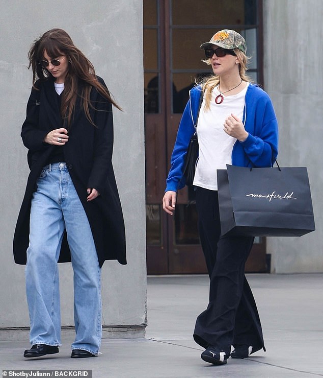 The Lost Daughter star wore wide-leg jeans in a light wash and a black jacket