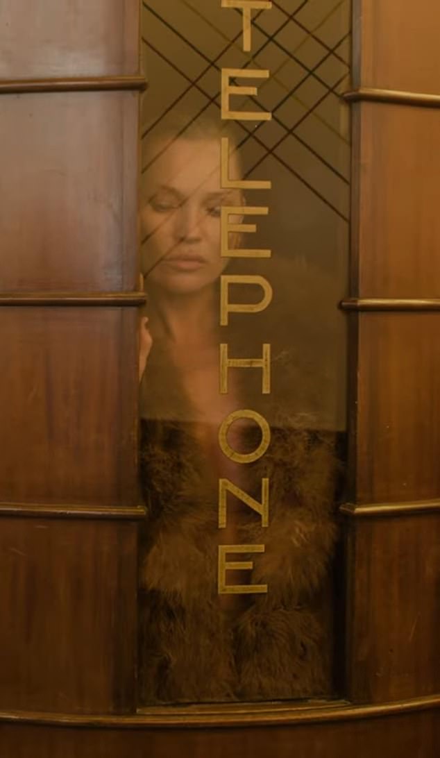 In one scene from the ad, Kate is seen through the foggy window of a hotel phone booth