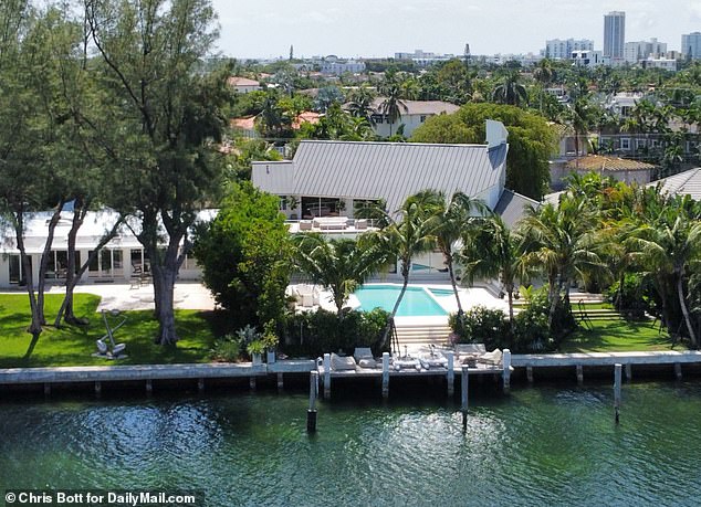 The home also comes complete with a generous dock displaying outdoor sofas and lounge chairs, and offering beautiful views of the nearby creek.