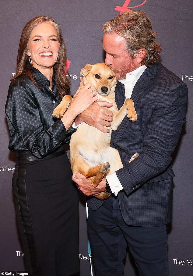 Susan is seen with her precious pup Frito and husband since 1986 Linden Ashby