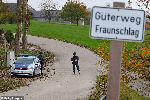 Law enforcement officers patrol during a manhunt on October 28, 2024 near Rohrbach, Austria