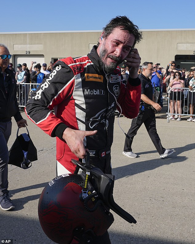 Reeves walks in the garage after a GR Cup Series auto race at the Indianapolis Motor Speedway on Oct. 5 in Indianapolis