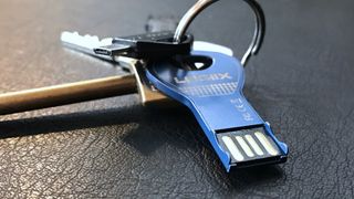 A USB-A flash drive on a keychain.