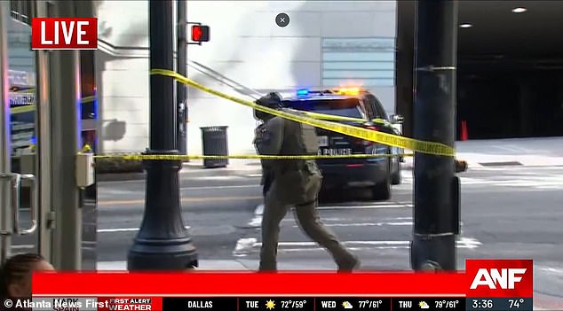 A SWAT officer is seen at the Four Seasons during the shooting at the hotel Tuesday afternoon