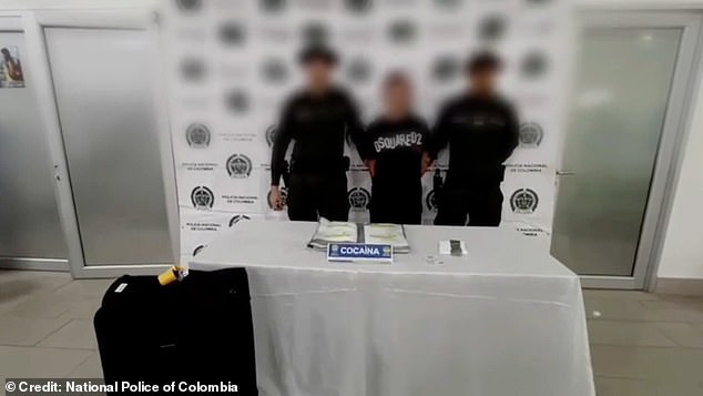 The Brit had to stand between two armed officers for his mugshot in an expensive Dsquared2 designer T-shirt after the discovery of the drugs