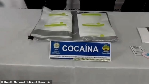 The illegal contents of his luggage, found in a false bottom, were laid out in front of him with a sign reading 'COCAINA' in capital letters.