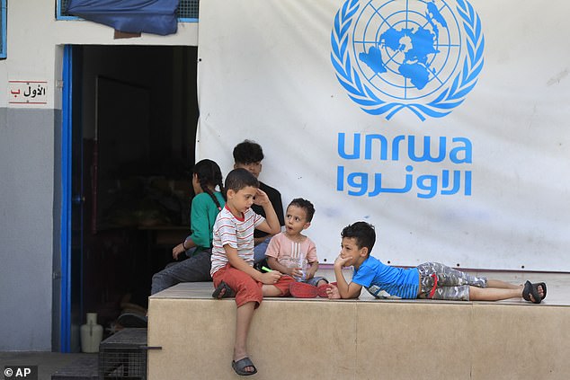 Palestinian children at an UNRWA school. A UN investigation has found that nine employees of the service, which employs 13,000 people, were 'possibly' involved in the attack on October 7 last year