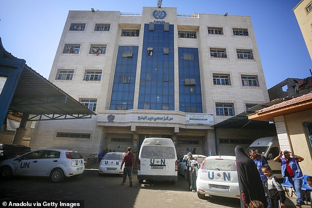 Palestinians outside a UN clinic in Deir al-Balah. British ministers warned that the move to block the agency risks 'compromising the international humanitarian response in Gaza'