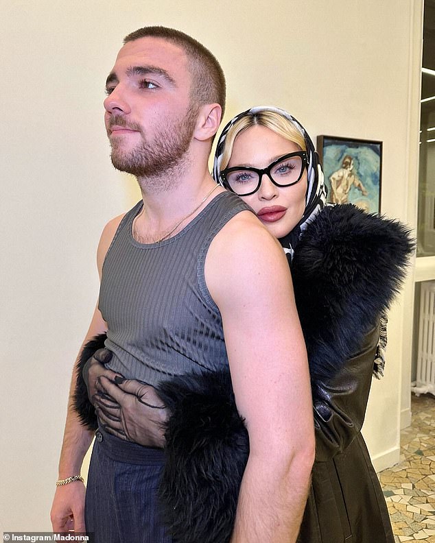 Madonna, 66, was in Paris this week to visit her son's art exhibition and was snapped with her arms around Rocco, 24, whose father is film director Guy Ritchie.