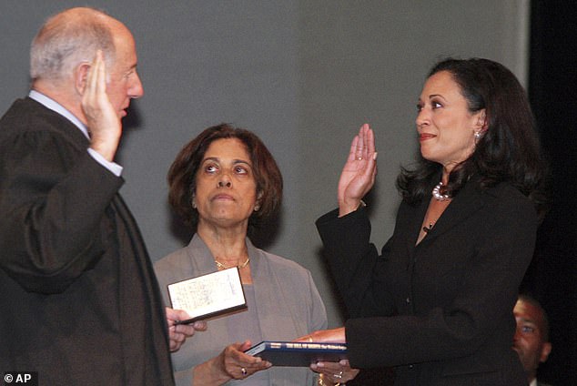 New San Francisco District Attorney Kamala Harris, right, receives with her mother Dr. Shyamala Gopalan a copy of the Bill of Rights, the oath of office of California Supreme Court Chief Justice Ronald M. George