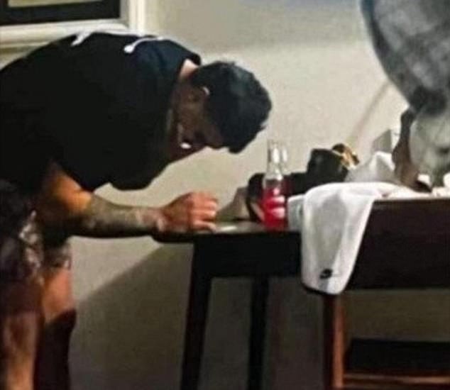 Mitchell was fined $20,000 by the NRL after the Integrity Unit investigated an image of him leaning over a table with white powder on it in a Dubbo hotel room (pictured)