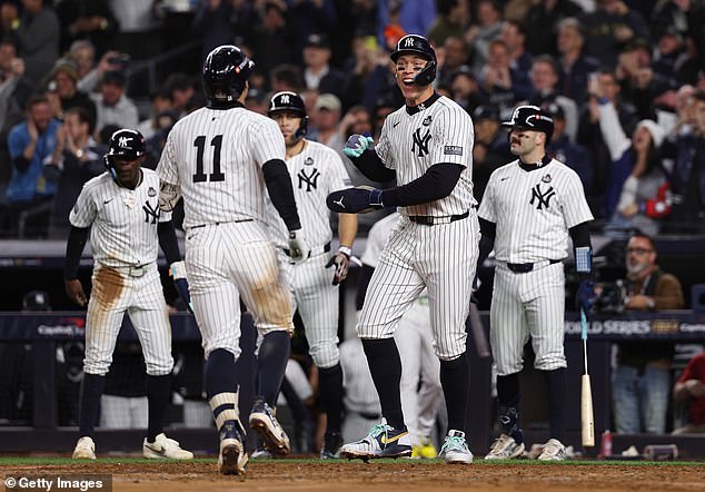 Aaron Judge celebrates with Volpe after his dramatic grand slam turned Game 4 on its head