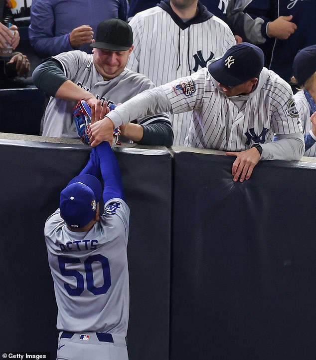 A Yankees fan tried to take the ball from Mookie Betts in dramatic scenes