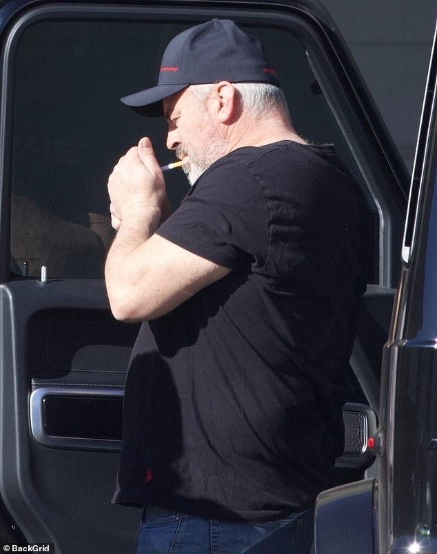 The Emmy-nominated star lit a cigarette as he got out of a car one fall day