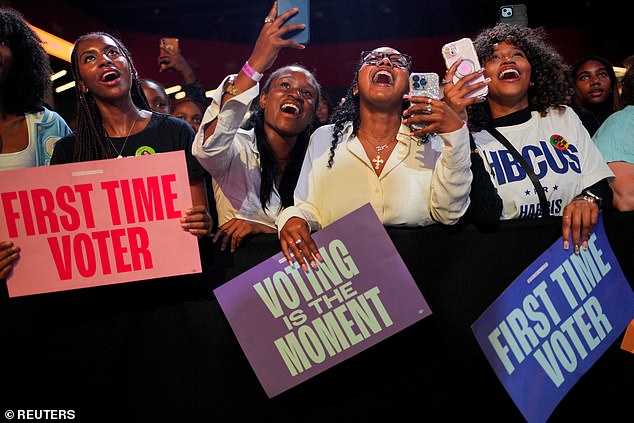 There were many enthusiastic supporters in the large crowd; many of them held signs saying they were voting for the first time