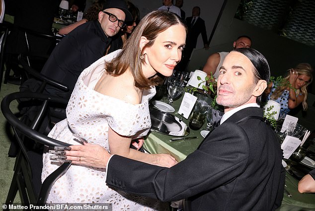 During the event, she posed at her table next to designer Marc Jacobs as they intently watched the ceremony