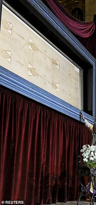 The shroud first appeared in France in 1354. After initially labeling it as fake, the Catholic Church has now embraced the shroud as real. In the photo, Pope Francis visits the Shroud of Turin in 2015