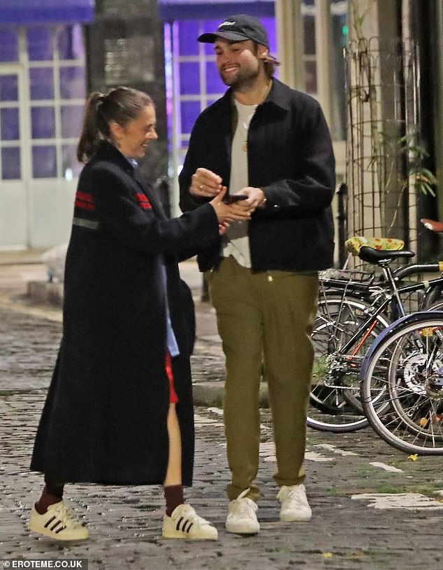 He completed his look with a black cap, white sneakers and a chunky gold chain