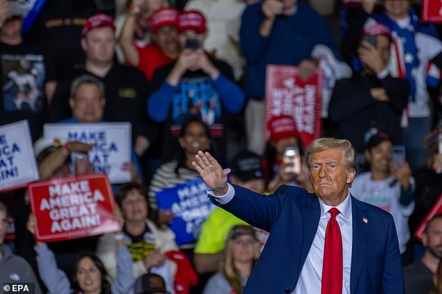 Former US President and Republican presidential candidate Donald J. Trump gestures during a campaign rally in Allentown, Pennsylvania, US, October 29, 2024