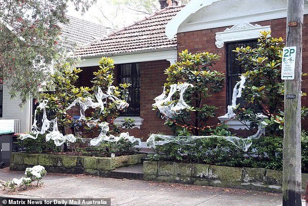 Homeowners string together cobwebs and spiders, add gravestones to their lawns and even place skeletons in their windows to celebrate the occasion