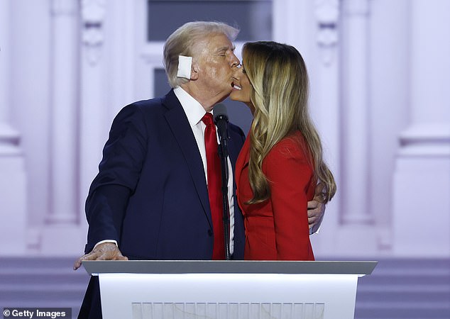 Donald Trump kisses former first lady Melania Trump after officially accepting the Republican presidential nomination on stage on the fourth day of the Republican National Convention in Milwaukee on July 18