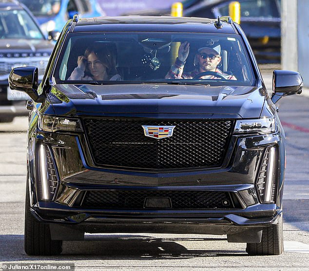 The mother of two opted to wear her auburn hair in a tight bun and a zip-up hoodie as she ran errands while being driven by a man driving a black Escalade.