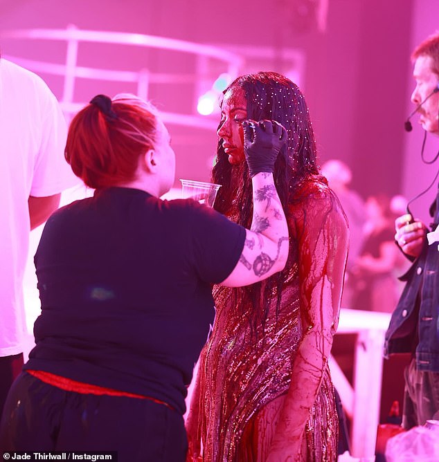 Jade was completely drenched in fake blood in a scene that mirrored the iconic horror Carrie for the music video