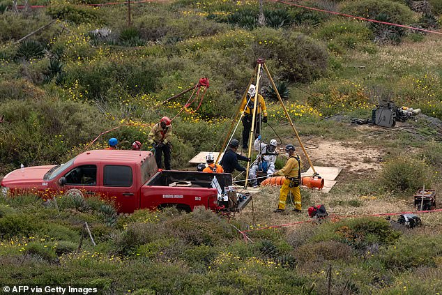 Authorities descended a deep well to retrieve the bodies of the Robinsons and Mr. Rhoades