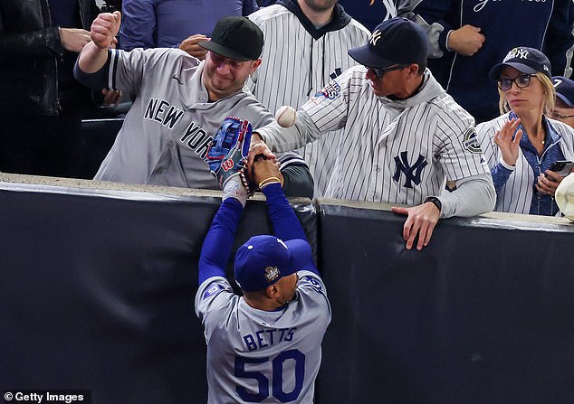 Yankees season ticket holder Austin Capobianco (left) went viral for the incident