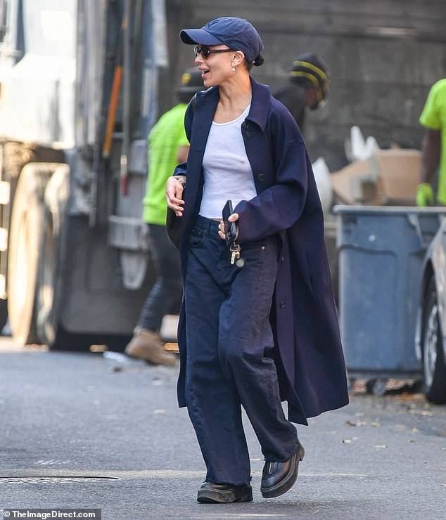 For her laid-back outing, the actress wore a navy blue jacket, matching pants, a white tank top and sneakers