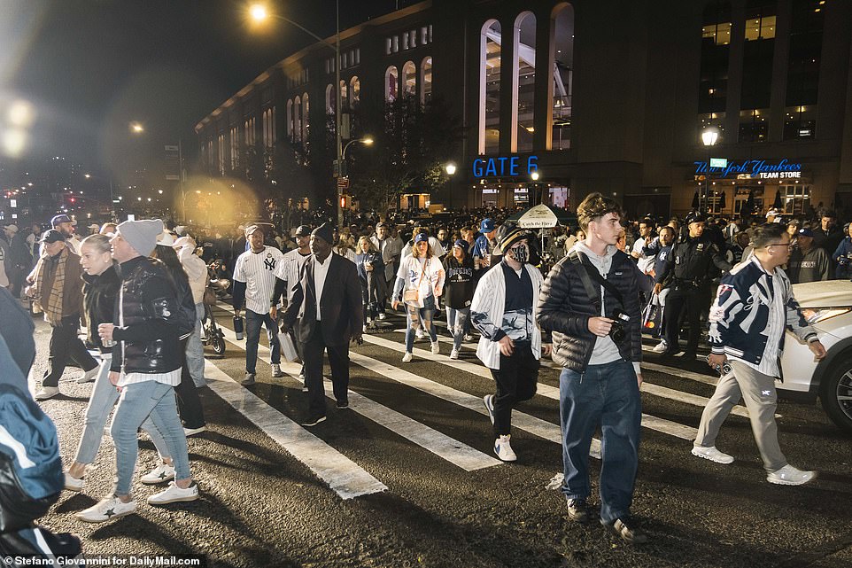 Both Yankees and Dodgers fans leave Yankee Stadium after a thrilling 11-4 game that kept the series alive