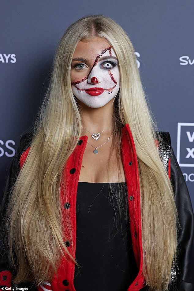 The daughter of Katie Price and Peter Andre wore a varsity jacket with black pants and fur snow boots, while wearing her long blonde locks down