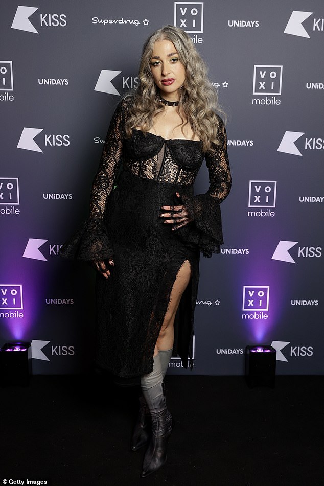 Show contributor Harriet Rose also attended the bash in a gothic look featuring black lace, with a sexy slit at the legs and paired with gray boots