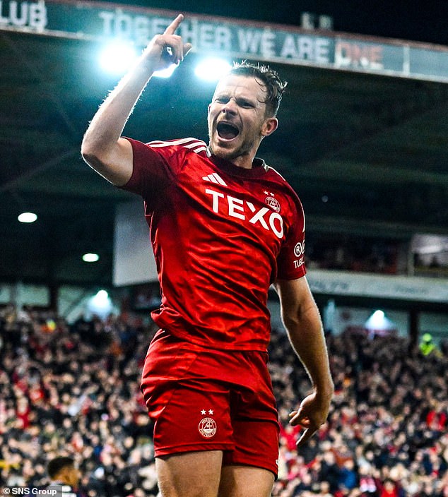 Aberdeen defender Nicky Devlin celebrates after scoring the opener at Pittodrie