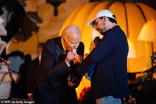 Biden gives a third baby a sip