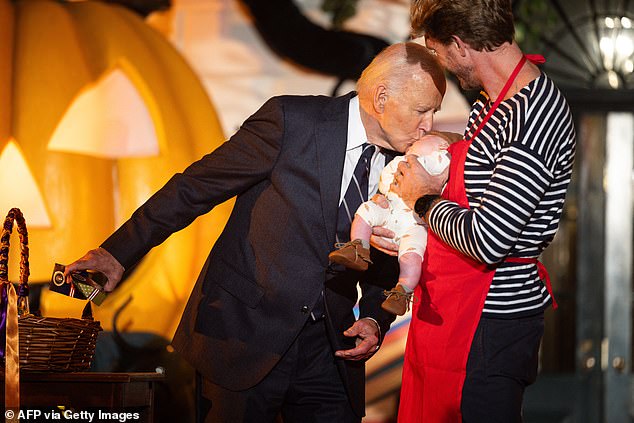 President Biden kisses a baby ghost