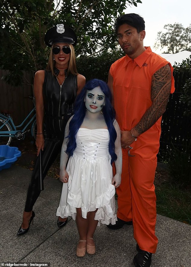 Jade zipped up her raunchy costume for a more modest display as she posed for a family photo with her daughter Victoria, who was dressed as the Corpse Bride