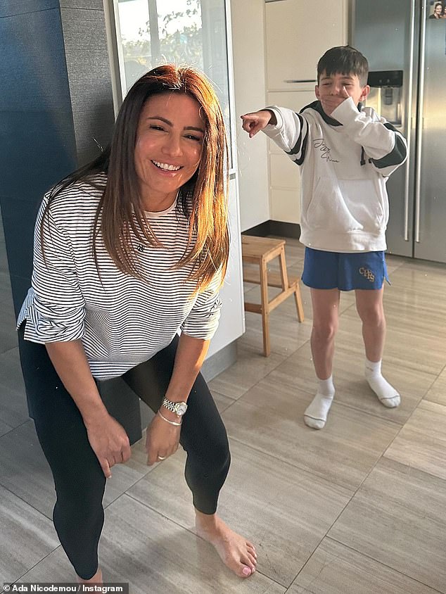 The clip then showed Ada immediately stopping the household chores she was doing, including cooking and vacuuming, to quickly crouch down and get back up after her son Johnas (right) called her.