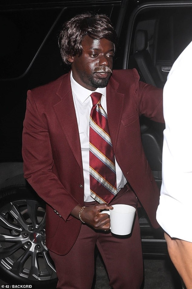 Daniel Kaluuya, 36, was spotted at the glitzy party dressed as Will Ferrell's famous Anchorman character Ron Burgundy, complete with coffee mug