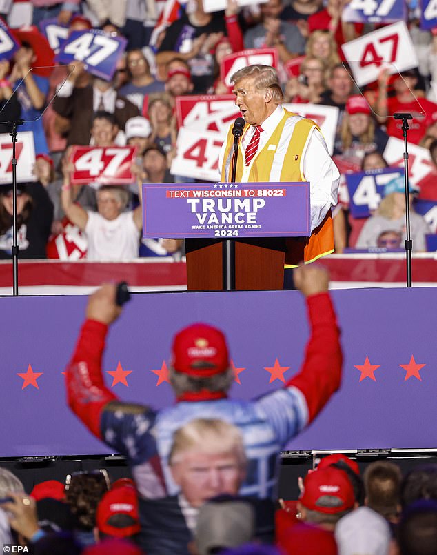 Trump kept the vest on for his rally in Green Bay and talked about how difficult it was to get into the truck