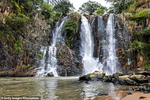 A married British businessman from Hong Kong has been charged with murder after his housekeeper was found dead at the bottom of a waterfall in Waterfall Bay Park on Monday morning.