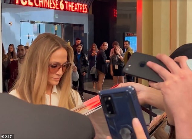 J-lo looked resigned as she stopped signing autographs after the bold question